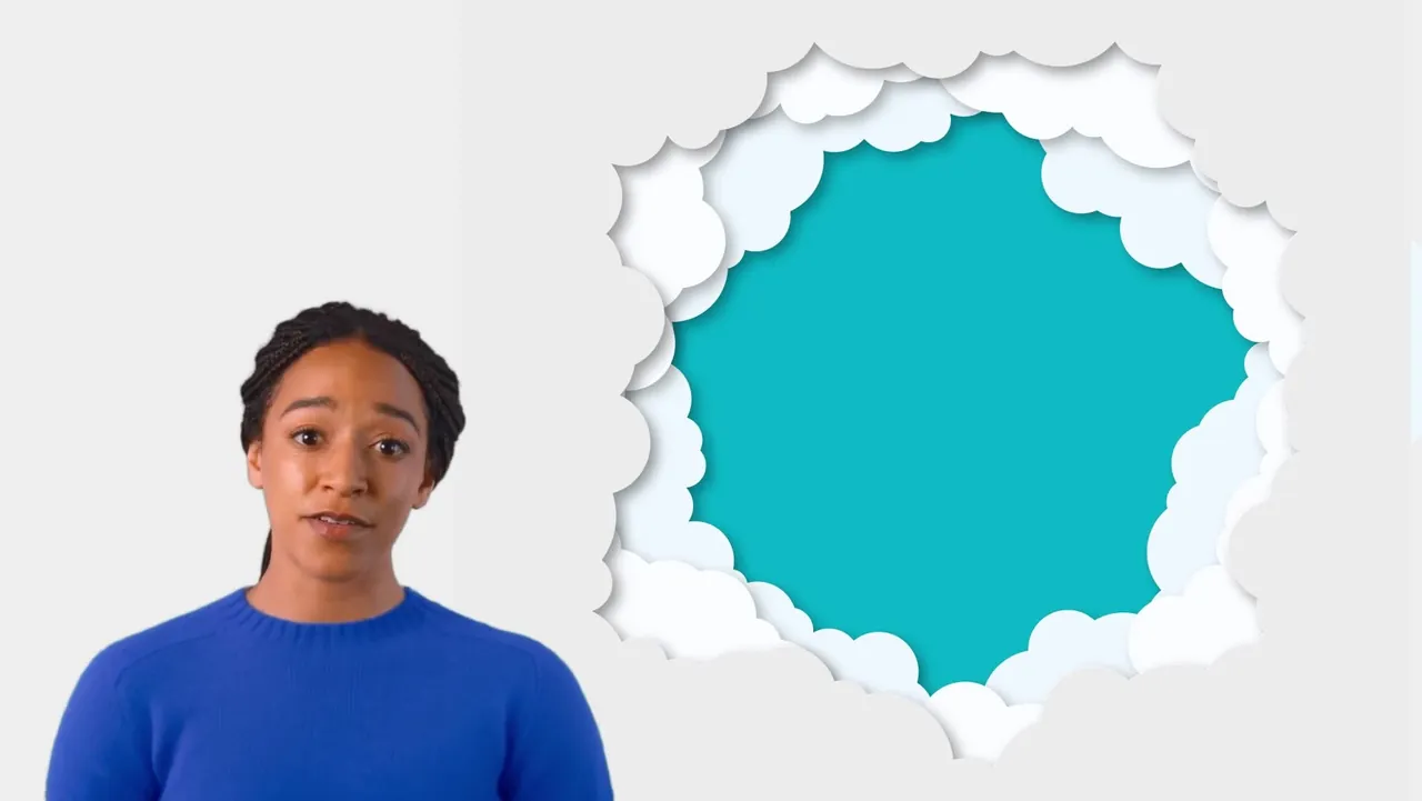 The presenter beside an opening in paper-cut clouds