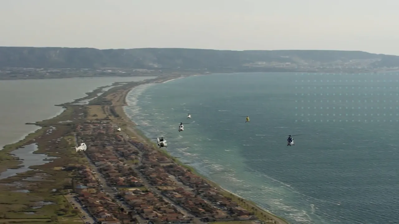 Helicopters flying over a coastline
